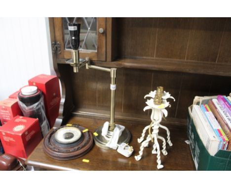 A pair of white painted wrought iron lamps (lacking leads), an adjustable brass table lamp and a mahogany cased barometer