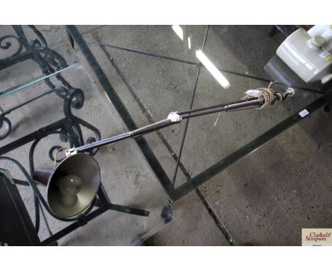A metal Anglepoise style lamp with clamp bracket, sold as a collectors item