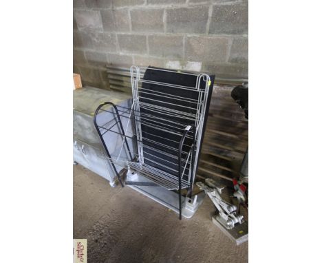 A parcel shelf, a metal clothes airer and a metal folding stand