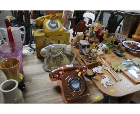 Three rotary style telephones