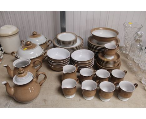 A collection of Denby tea and dinnerware to include tureens and covers, dinner plates, bowls, teapot, mugs and saucers etc