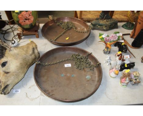Two copper balance scale pans