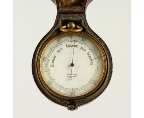 A TRAVELLING BAROMETER, in a leather case.