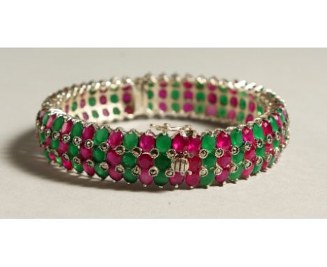 A GOOD SILVER THREE-ROW BANGLE.