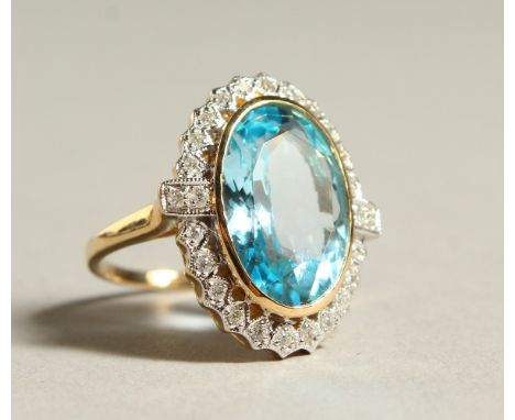 A 9CT GOL, DIAMOND AND BLUE TOPAZ LARGE CLUSTER RING.