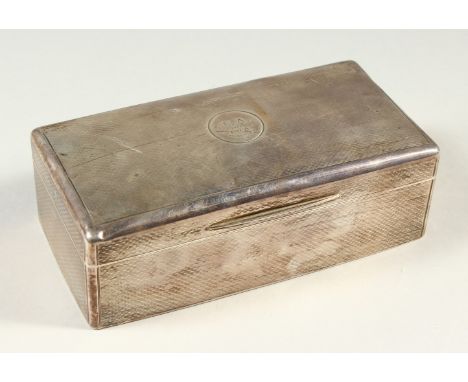 A LARGE ENGINE TURNED SILVER CIGARETTE CASE. 17cms long.  London 1911.