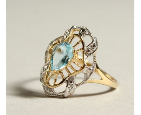 A 9CT GOLD, BLUE TOPAZ AND DIAMOND RING.