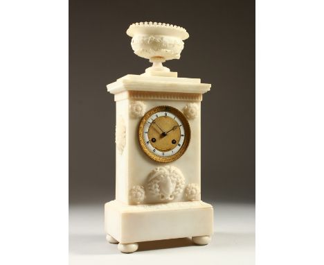 A FRENCH EMPIRE CLOCK, with white enamel chapter ring, ornate dial and bezel, in a carved alabaster case with urn finial, sig