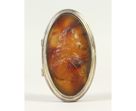 AN 18TH CENTURY FRENCH OVAL SNUFF BOX, the top with a portrait in tortoiseshell. 9cms long.