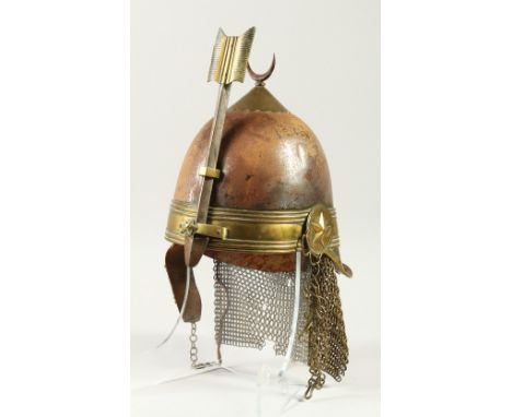 A RARE 17TH-18TH CENTURY TURKISH STEEL AND BRASS MOUNTED HELMET, with crescent finial and an arrow with leather strap and mes