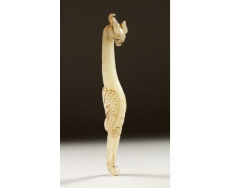 A WHITE JADE BELT HOOK. 15cms long.