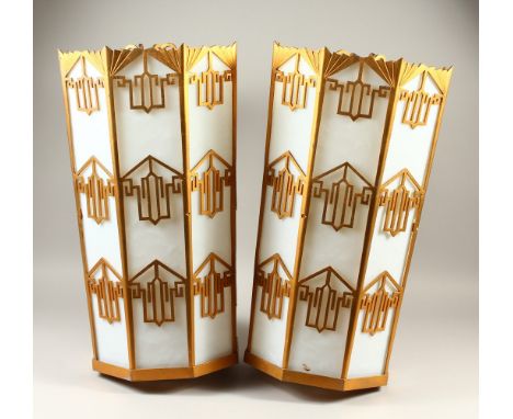 A PAIR OF ART DECO STYLE HANGING LANTERNS, with opaque glass panels in pierced gilt metal frames. 60cms high x 33cms wide.