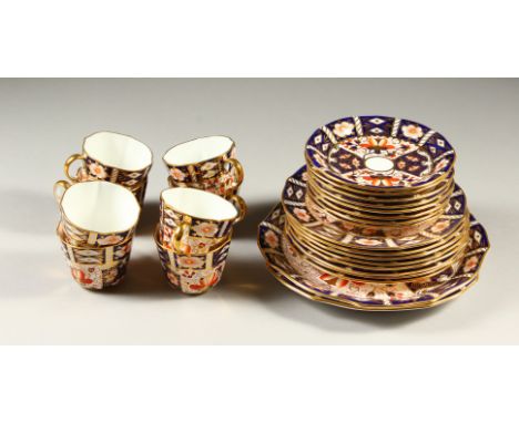 A ROYAL CROWN DERBY JAPAN PATTERN PART TEA SET, comprising eight cups and saucers, eight 18cm plates, and a pair of 22cm plat