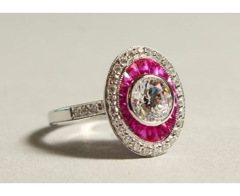 A SILVER PASTE OVAL CLUSTER RING.