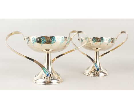 A GOOD PAIR OF WMF ART DECO TWO-HANDLED CIRCULAR TAZZAS, with blue enamel decoration. 19cms diameter.