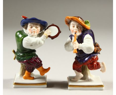 A SMALL PAIR OF CAPODIMONTE  FIGURES OF DWARFS, playing musical instruments. 11cms high.