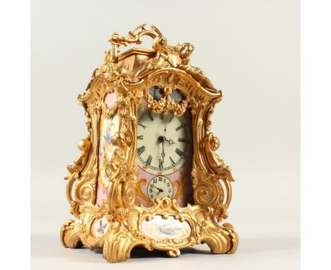 A ROCOCO STYLE CARRIAGE CLOCK, with Sevres style pink porcelain panels, decorated with nesting birds. 23cm high.