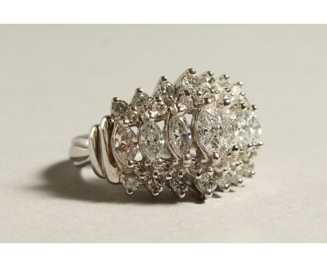 A GOOD 14CT GOLD, MARQUISE AND ROUND CUT DIAMOND RING.