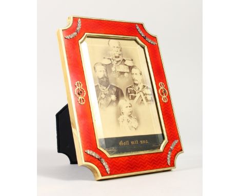 A SUPERB RUSSIAN "FABERGE" DESIGN SILVER GILT AND ENAMEL PHOTOGRAPH FRAME, set with diamonds and cabochon rubies. 19.5cms x 1