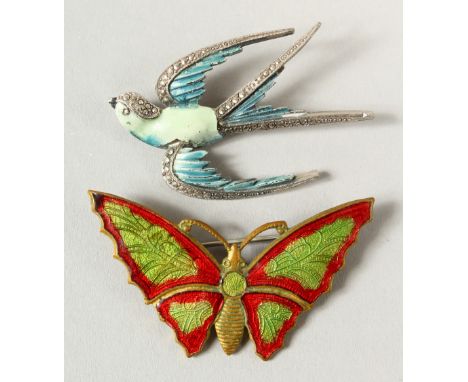 AN ENAMEL BUFFALO BROOCH and A SWALLOW BROOCH.