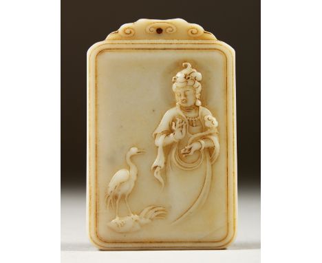 A CARVED WHITE JADE PENDANT, decorated with Guanyin and calligraphy. 7cms high.