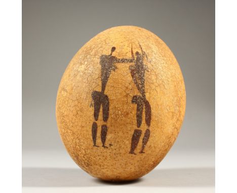 AN EMU EGG, naively painted with hunting figures. 14cms high.
