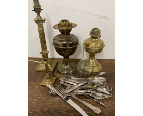 A brass column lamp with oils lamps  and E.P.N.S cutlery