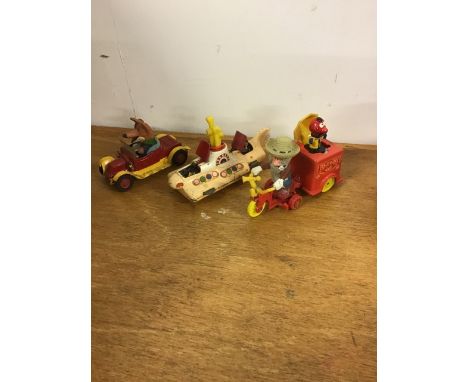 Three Corgi movie/tv related vehicles. To include Basil Brush car, The Beatles Yellow Submarine and The Magic Roundabout tric