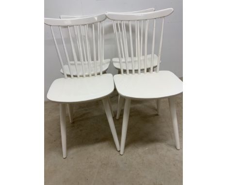 Four white painted stick back chairs possibly Ercol.W:40cm x D:40cm x H:82cm