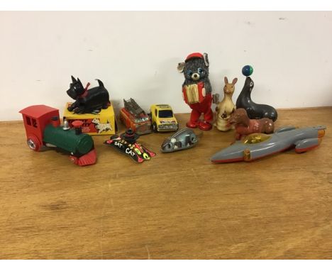 Eleven of vintage toys. To include Yone mouse, a Hot Dog, a seal with ball on nose, a kangaroo with babies in pouch, a Jimson