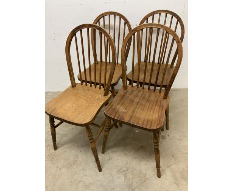 Four mid century pine stick back chairs.W:36.5cm x D:38.5cm x H:88cm