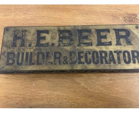 Vintage brass sign, H.E.Beer builder and decorator on oak panel.W:32cm x D:11.5cm x H:3cm