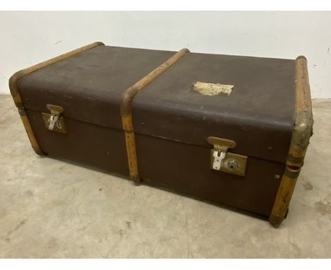 A Vintage wood bound travelling trunk. W:84cm x D:50cm x H:31cm