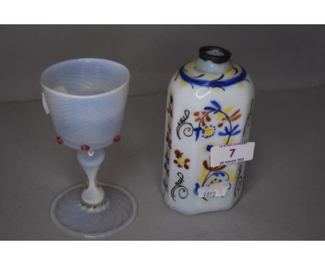 A wine glass having opalescent glass with twist cup on baluster stem with folded foot, and a white glass and decorated tea ca