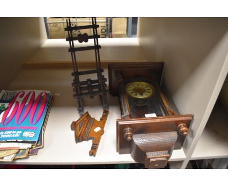 A mahogany cased wall clock having carved details and finiakls to base, AF, also a small scale rocking chair.