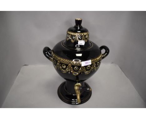 A ceramic tea urn or samovar having gilt and enamel decoration