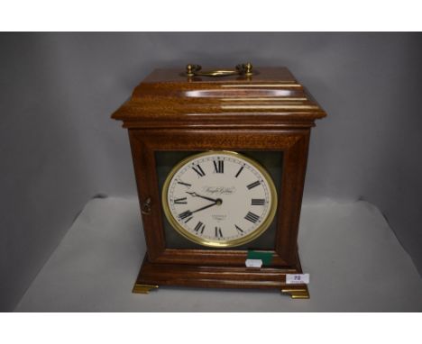 A modern bracket style mantle clock by Knight and Gibbins