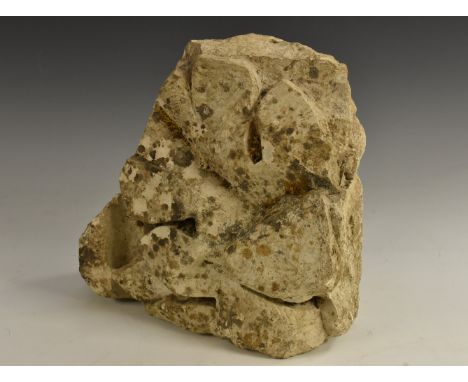 A Medieval masonry limestone architectural corbel, naturalistically carved as a leaf, 26cm high, 13th century 