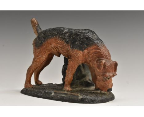 An Austrian cold painted spelter novelty table lighter, as a black and tan terrier, 17cm wide, c.1925