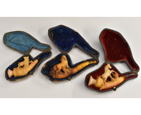 A German novelty pipe, modelled with a a horse standing bedside a gate, 9.5cm long, leather case; others, simlar (3) Conditio