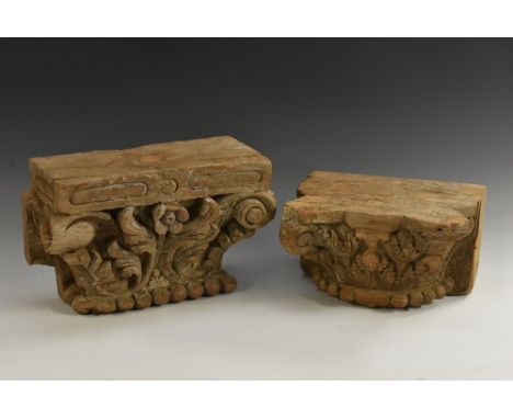 An Indian hardwood architectural fragment, carved as a Corinthian capital, 27cm wide, 19th century; another, similar (2)