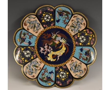 A Japanese cloisonne enamel shaped circular charger, brightly decorated with dragons and phoenix, 31cm diam, Meiji period Con