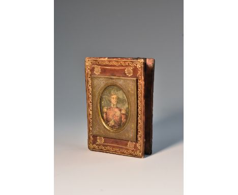 A Victorian tooled and gilt morocco pen wipe, applied with a portrait miniature and inscribed J L Baldwin from Lady Raglan, J