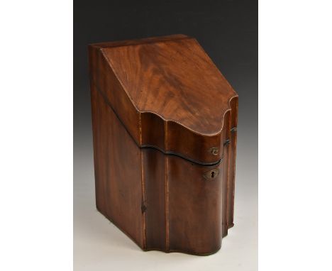 A George III mahogany commode fronted knife box, the hinged cover inlaid with a marquetry eight-pointed star within a rope tw