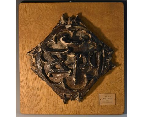 Byron Interest - a 17th century gesso and softwood kite-shaped ceiling boss, carved with a central monogram, 25cm wide, mount