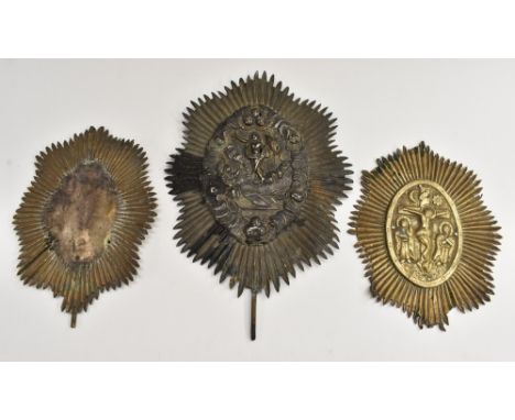 A Continental silver coloured metal icon, chased with the Risen Christ and St George Cross, on a brass ground of radiating li