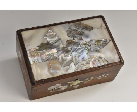 A Chinese hardwood and mother of pearl marquetry rectangular box, hinged cover inlaid with pagodas in a monumental landscape,