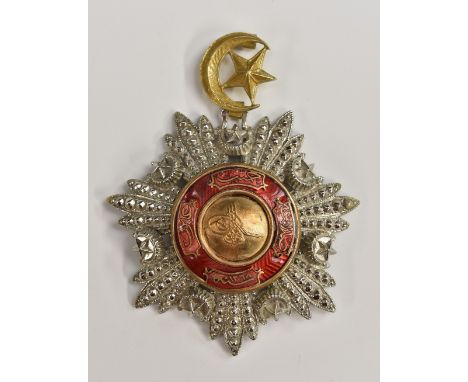 Medals and Decorations - Turkish Empire - an Order of the Medjidje award, the central boss with tughra, within a band of red 