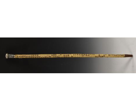 A 19th century shark vertebrae walking cane, Chinese silver  pommel, embossed with figures and foliage, 91.5cm long  Conditio