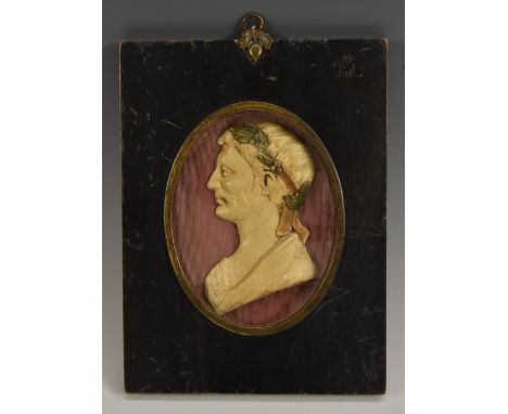 A composition portrait plaque, of a Roman emperor, bust length in profile, 12.5cm x 9.5cm, ebonised frame 